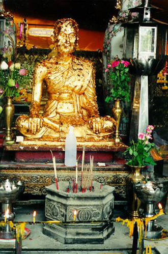 Gold leaf on a small buddha inside Wat Pho