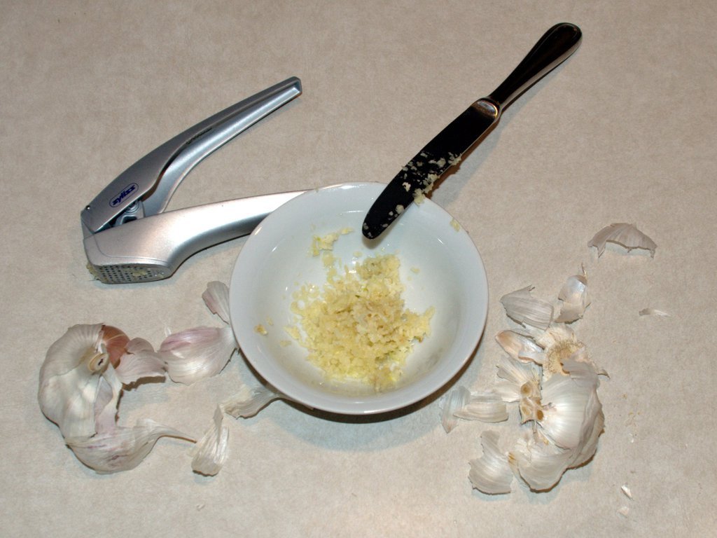 Raw garlic and a great garlic press