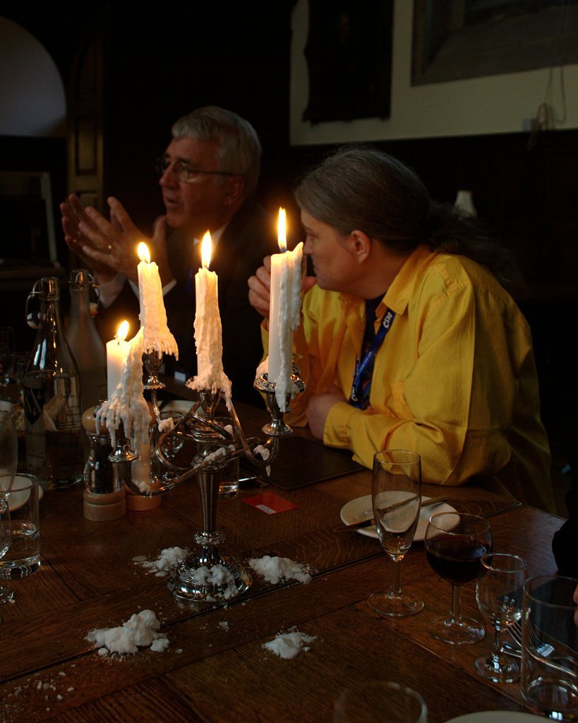 Conversation by candle light at the formal dinner