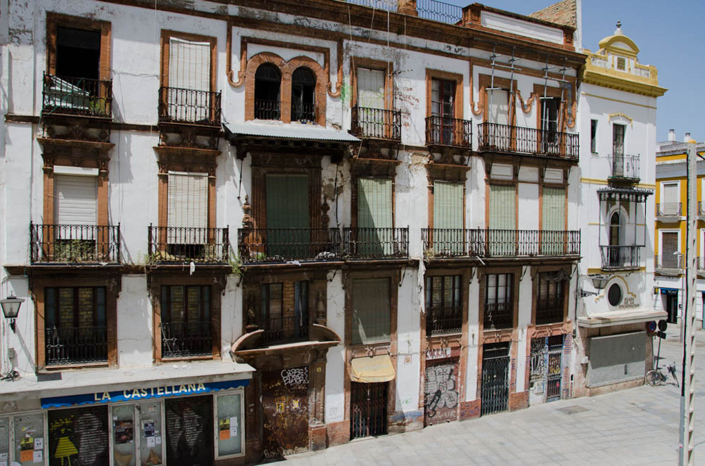 Delapidated building behind the parasol