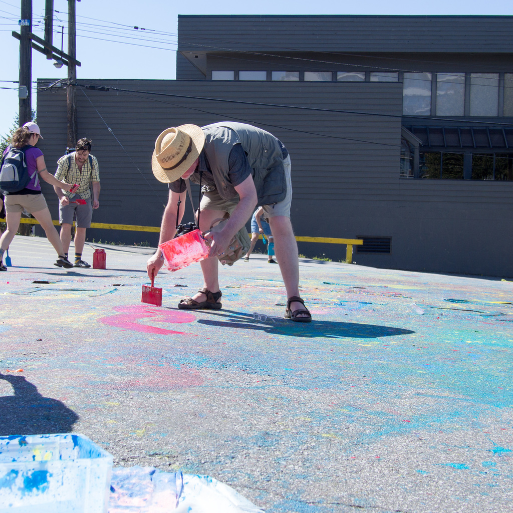 Tim paints the parking lot