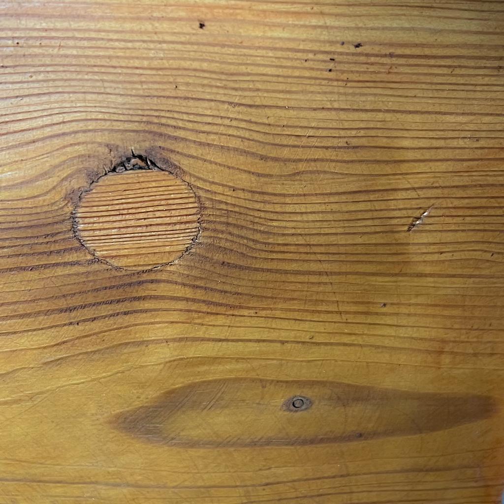 Patched knot on a wooden plank that gives a vague impression of the Great Red Spot on Jupiter. (Caption)