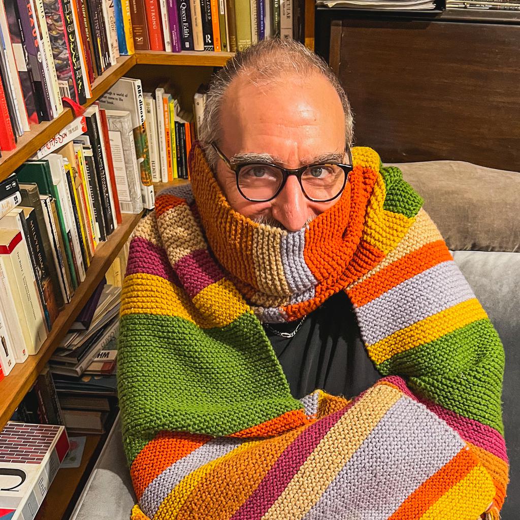 Norm wrapped in a classic Dr Who scarf of the Tom Baker era