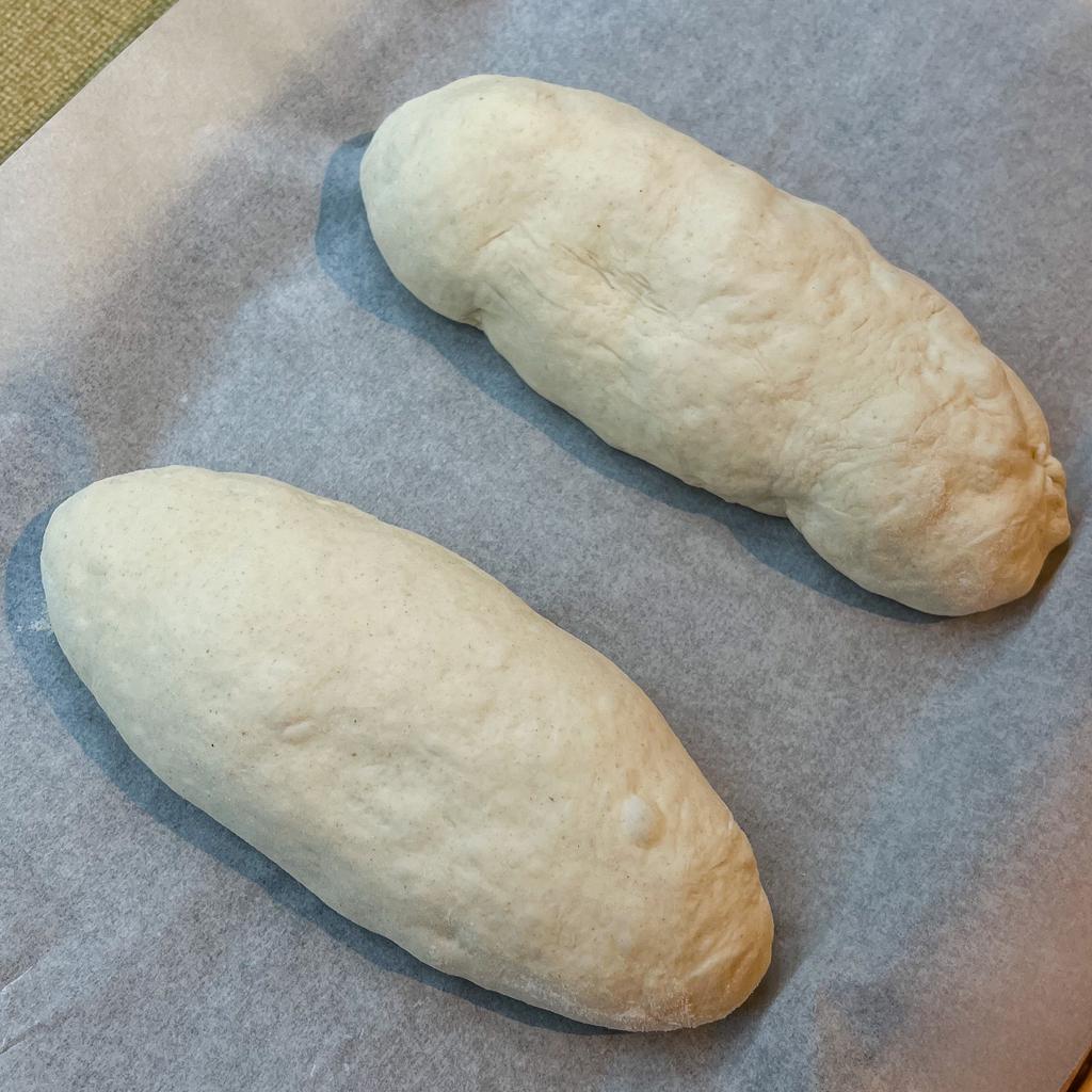Two sourdough bâtard shapes waiting for the final rise.