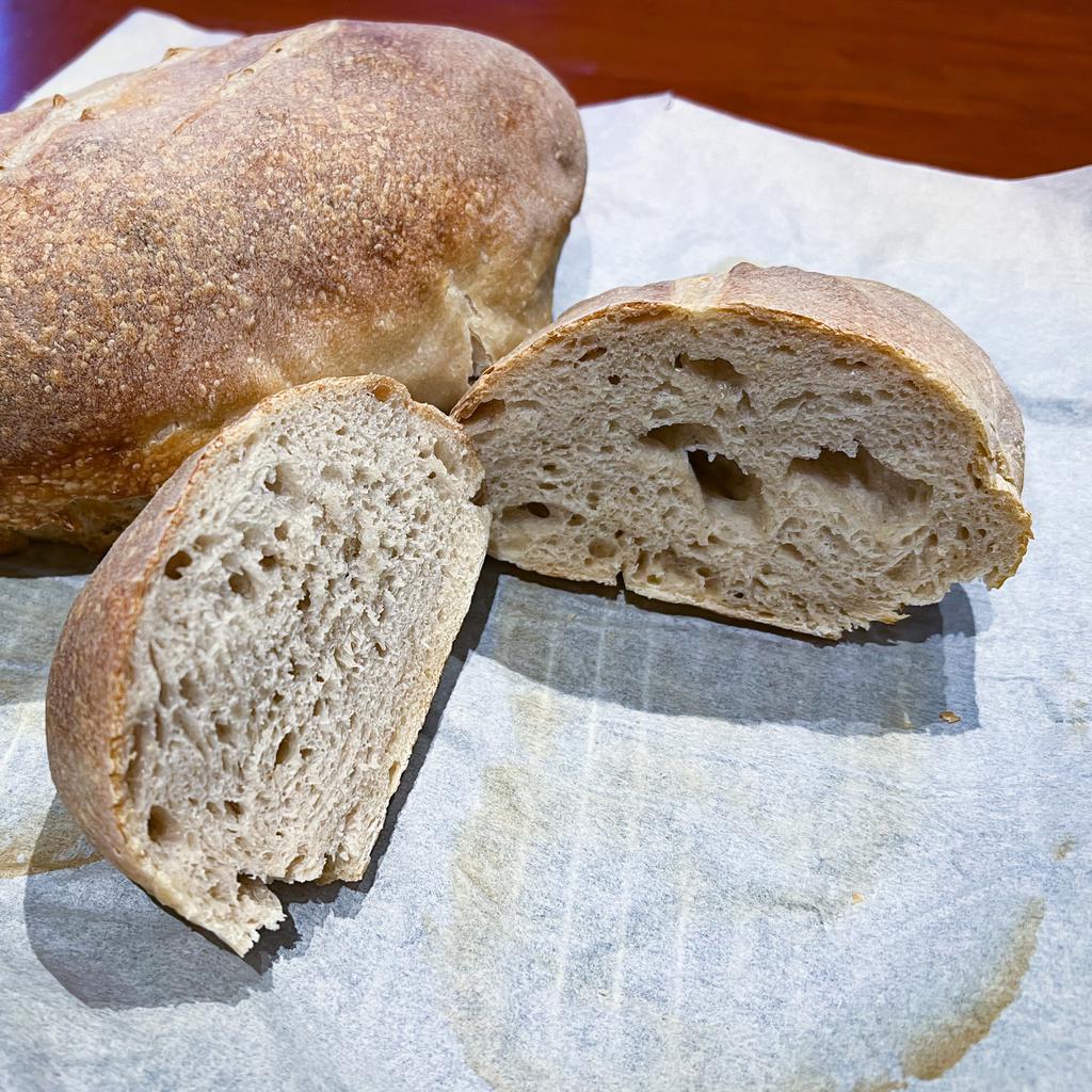 Sourdough loaves, one cut open