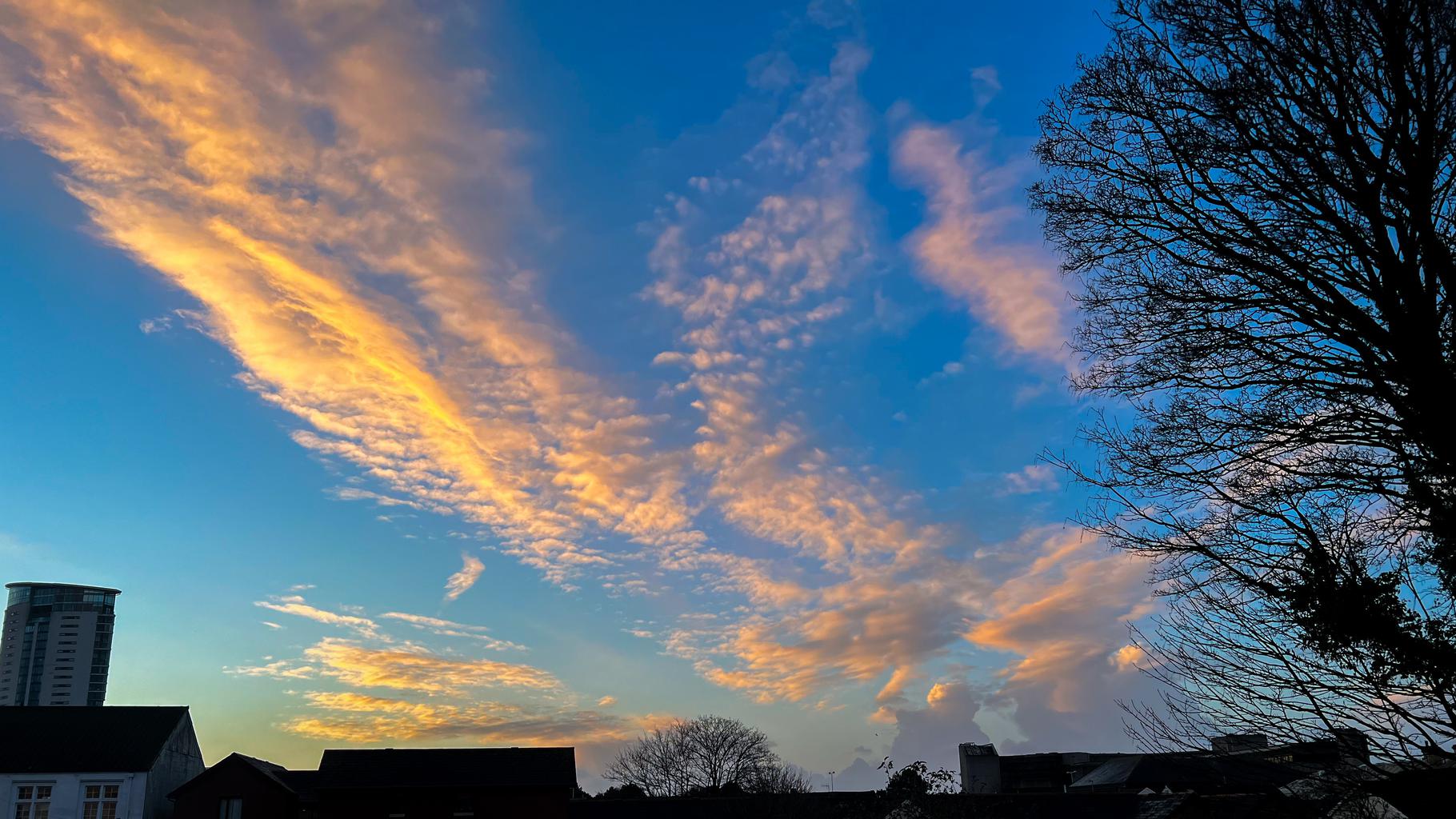 Morning clouds against a blue sky.