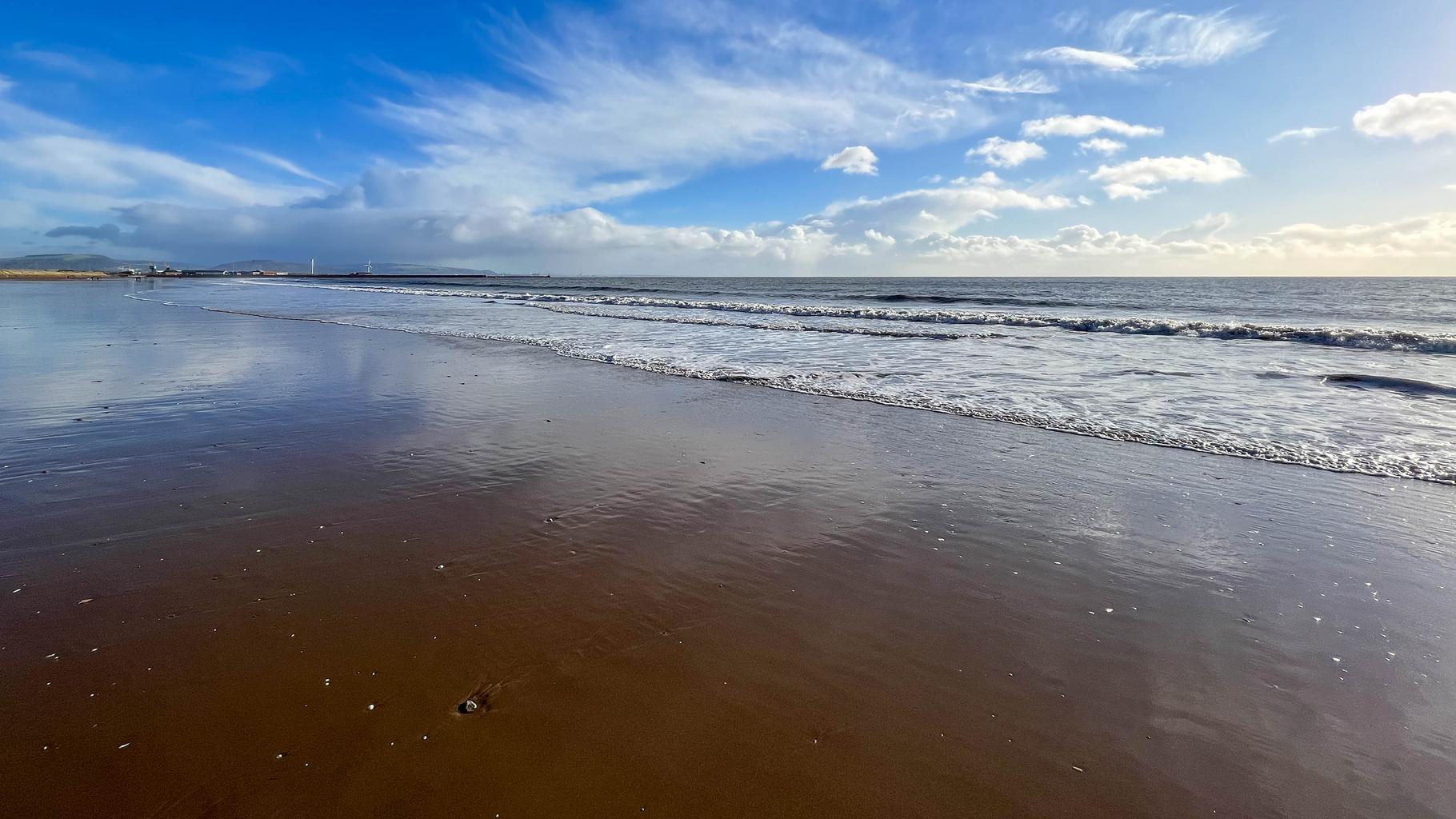 Swansea bay beach on a calm, sunny day