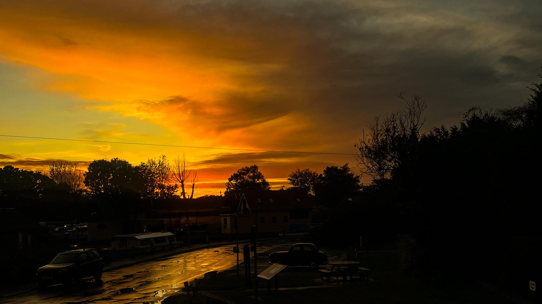 A bright orange sunset over the broads in Norfolk.